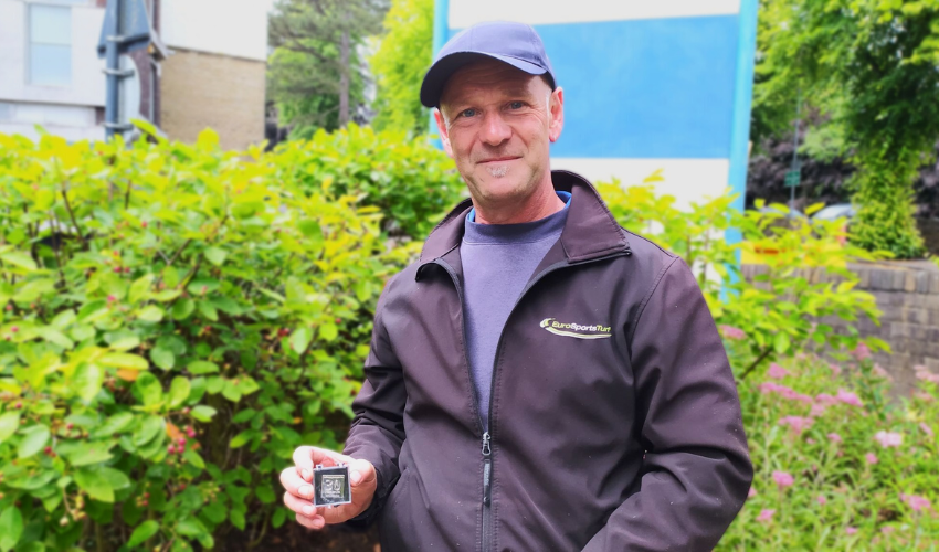 Tony Martin with his long service award