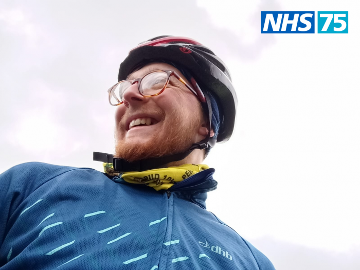 Mat Drew in cycling clothing smiling off camera