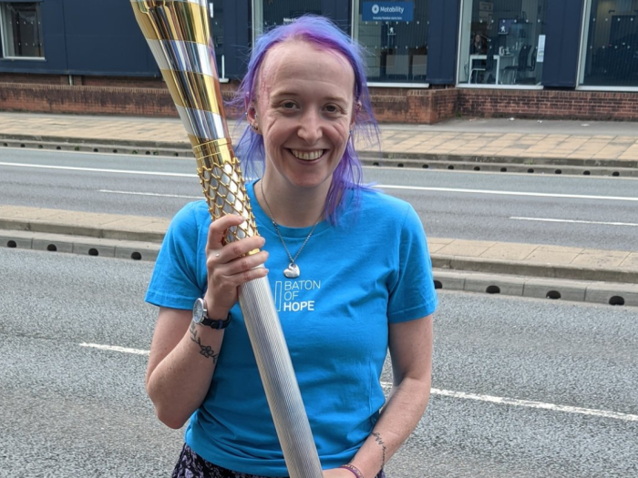 Ellie holding baton of hope