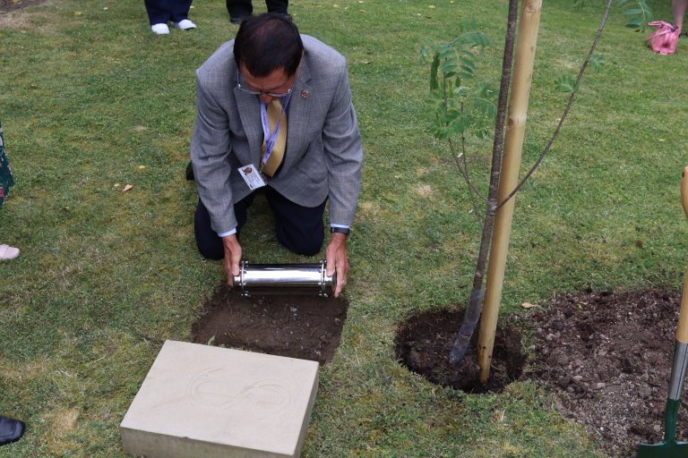 Councillor for West Ecclesfield Ward, Alan Hooper, placing the time capsule into the ground