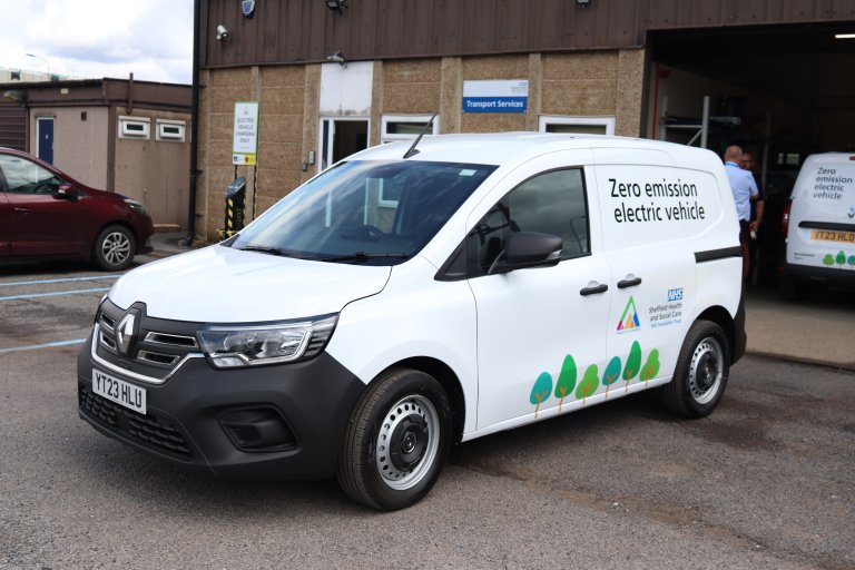 white van with livery showing it is an electric vehicle