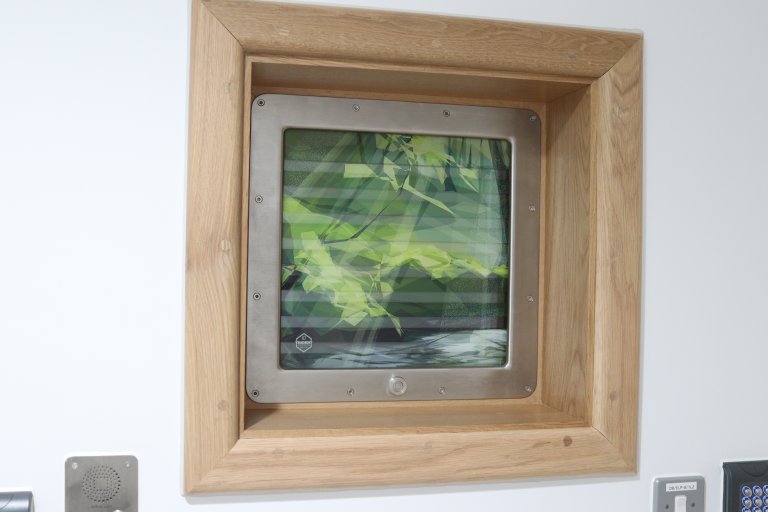 Window with forestry artwork across the pane
