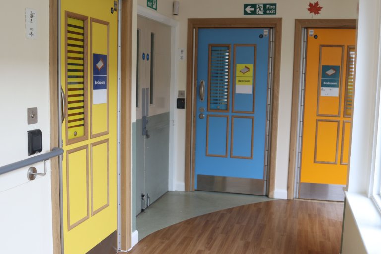 Bright yellow, blue and orange bedroom doors